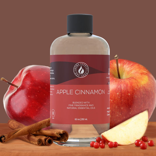 Apple Cinnamon diffuser oil by Aroma Country surrounded by fresh apples, cinnamon sticks, and berries—crafted with fine fragrance and essential oils.
