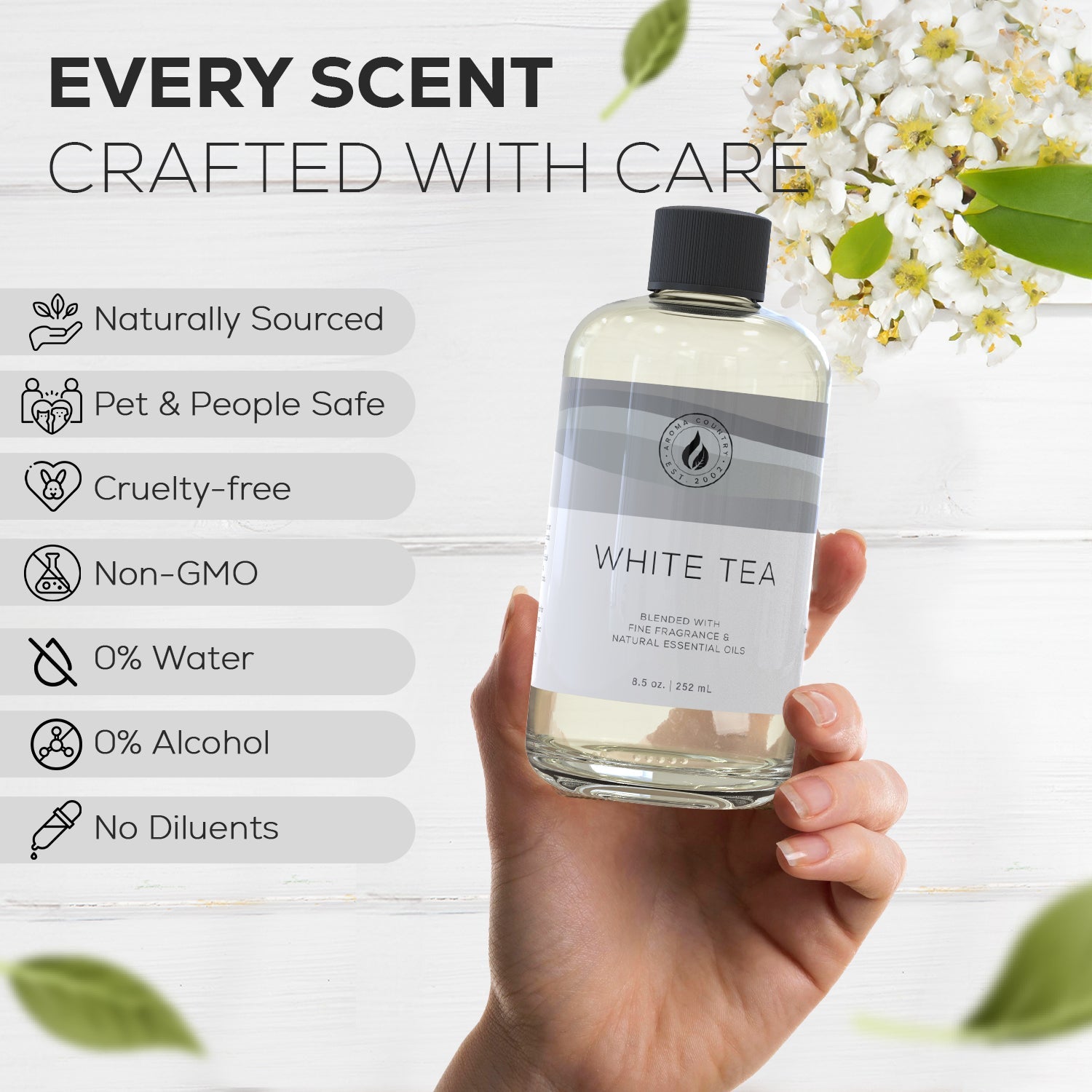 White Tea diffuser oil from Aroma Country held in hand, highlighting benefits like 0% water and alcohol, cruelty-free formulation, and pure essential oil blend for cold air diffusion.