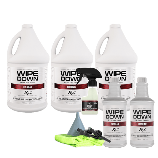Complete Wipe Down Fresh Air kit by Blaze Away, featuring three 1-gallon jugs, two 32 oz bottles, a 16 oz trigger spray, funnel, microfiber cloth, and accessories for all-surface odor control.